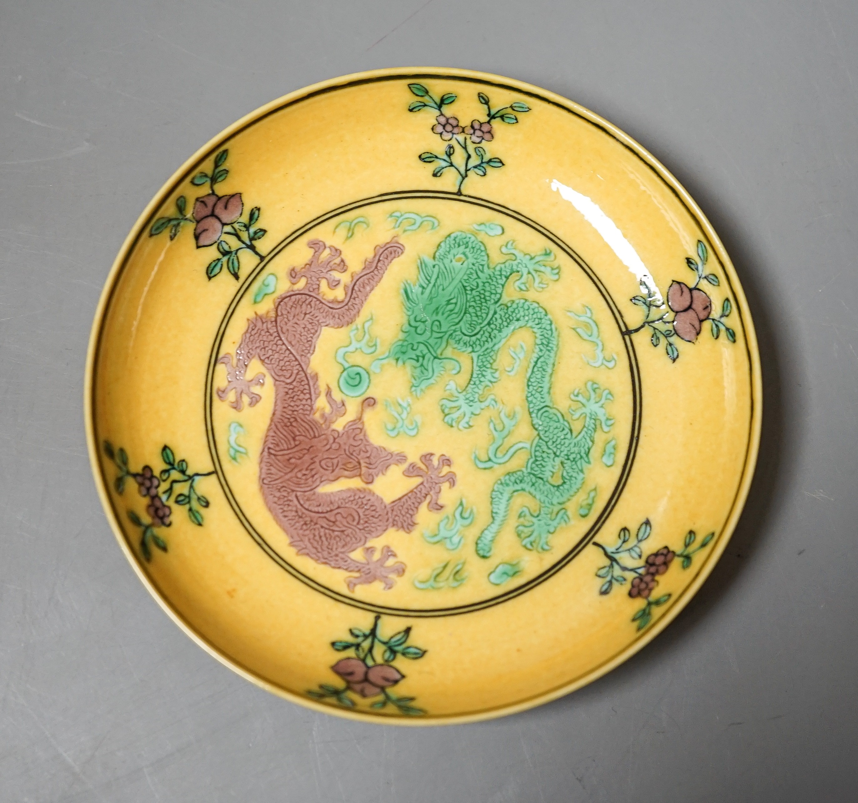 A Chinese yellow ground green and aubergine enamelled 'dragon' dish, Guangxu mark and possibly of the period, D.11cm